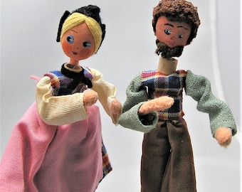 Two Vintage BAPS Doll Puppets. Man and Woman Couple in Plaid. Woman Has Pink Apron. Each Measures About 4 1/2 Inches Plus Wire Support. (BB)