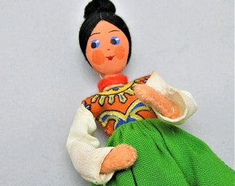 Vintage BAPS Doll Puppet. Woman with Colorful Outfit in Red and Green. Black Hair. Measures 4 1/2 Inches Plus the Metal Wire Support.  (BB)