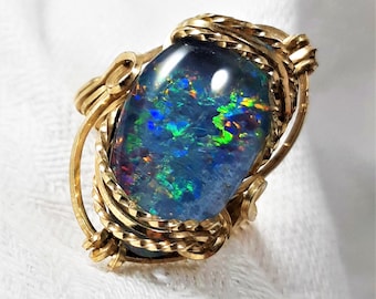 Vintage Wire Wrapped Opal Ring in a Size 9 1/2. The Triplet Stone Measures About 21 by 12mm and Flashes Red, Orange, Green, and Blue. (D42)