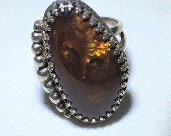 Vintage Size 6 1/2 Sterling and Fire Agate Ring is Signed Sam Diaco. Stone is About 1 Inch by 5/8 of an Inch. Prongs and Bead Setting. (D30)