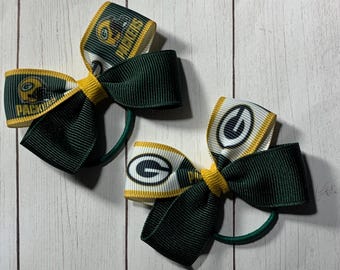 Green Bay Packers Football 2” Pigtail Hair Bow, so cute for her first football game.  NFL football bow.  Matches Green Bay Packers