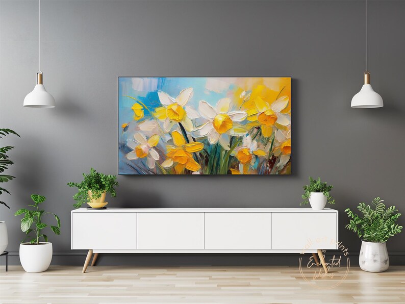 May include: A painting of a bouquet of white and yellow daffodils with green leaves against a blue and white background.