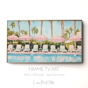 May include: A framed digital art print depicts a poolside scene with pink umbrellas, white lounge chairs, and palm trees. The artwork has a gold frame and the text "FRAME TV ART" is visible. The image is a digital download from Luna Print Studio.
