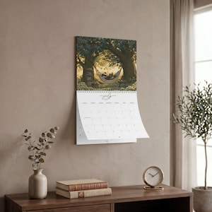 2027 wall calendar featuring cute woodland animals reading books, twelve
illustrated forest library scenes with fox, hedgehog, rabbit, squirrel, otter and
raccoon in hollow-tree bookshops and mushroom libraries, cozy cottagecore
storybook art, 12 month hanging calendar printed and shipped, book lover gift for
readers librarians and teachers, reading nook and home office decor