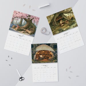 2027 wall calendar featuring cute woodland animals reading books, twelve
illustrated forest library scenes with fox, hedgehog, rabbit, squirrel, otter and
raccoon in hollow-tree bookshops and mushroom libraries, cozy cottagecore
storybook art, 12 month hanging calendar printed and shipped, book lover gift for
readers librarians and teachers, reading nook and home office decor