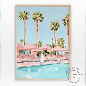 May include: A framed art print shows a poolside scene with palm trees, pink parasols, and sun loungers. A ghost figure stands near the pool. The artwork has a light blue sky and a light pink and blue colour palette.