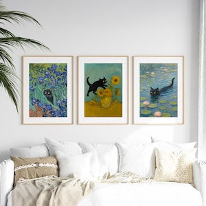 May include: Three framed art prints featuring black cats in famous paintings. One print shows a cat in irises, another with sunflowers, and the last with water lilies. The prints are displayed above a white couch.
