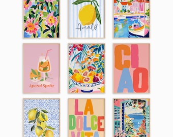 May include: Nine framed art prints with colorful illustrations. The prints feature floral patterns, lemons, coastal scenes, and Italian phrases like "Ciao" and "La Dolce Vita." The artwork includes images of cocktails and fruit.
