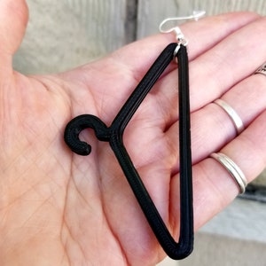 May include: Black 3D printed hanger earring with a silver hook.