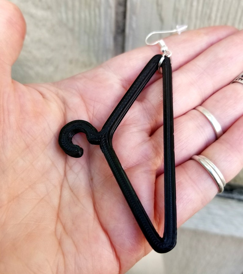 May include: Black 3D printed hanger earring with a silver hook.