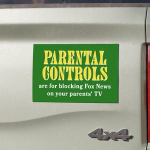 May include: A green rectangular bumper sticker with yellow text that reads "PARENTAL CONTROLS are for blocking Fox News on your parents' TV" is affixed to the back of a light green pickup truck. The truck has a 4x4 emblem.