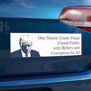 May include: A rectangular white bumper sticker featuring a dark blue illustration of Donald Trump on the left side and the black text: One Nation Under Fraud Clearly Visible with Bribery and Corruption for All, displayed on the right side.