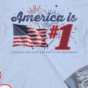 America is #1 ... in Health Care Costs - Unisex Softstyle T-Shirt - Funny Snarky Anti-Health Insurance CEO Patriotic USA Medicare for All