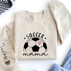 Personalized Soccer Mama Hoodie: Custom Name Sleeve, Game Day Apparel