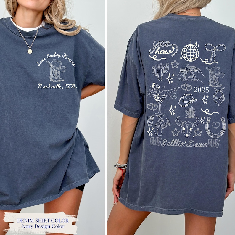 May include: Denim blue t-shirt with ivory design. Front features text "Some Cowboy Forever" with a cowboy hat and boots. Back has "Yee Haw" and country-themed illustrations, including a disco ball and horseshoe. The text "2025" and "Settlin' Down" are also visible.
