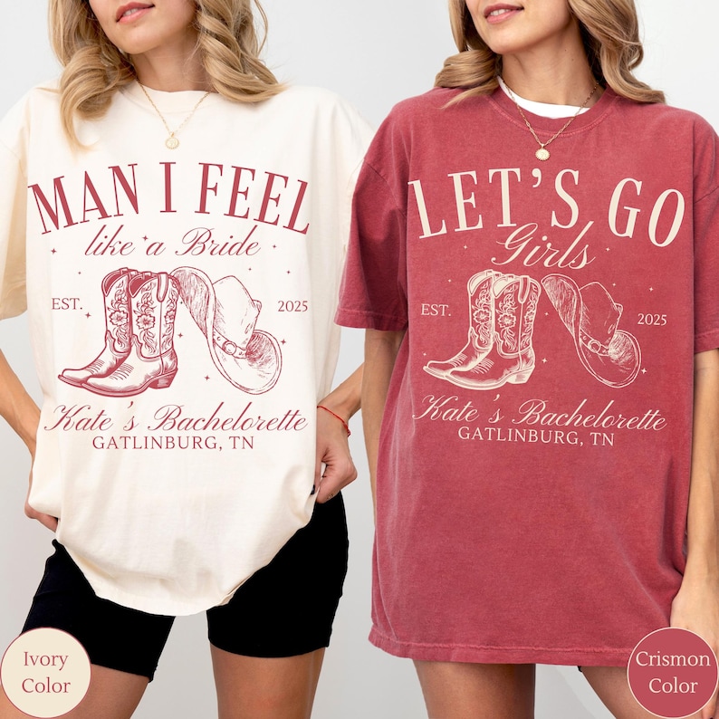 May include: Two t-shirts, one ivory and one crimson, with a western-themed design. The ivory shirt reads "Man I Feel like a Bride" with cowboy boots and a hat graphic. The crimson shirt says "Let's Go Girls" with similar graphics.