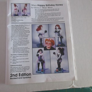 May include: A printed pattern for a cloth doll named "Mimi's Happy Birthday Honey" by Gloria J. "Mimi" Winer. The pattern includes instructions for a 16-inch doll with optional faces, hands, and armature. The 2nd Edition is revised and updated.