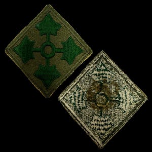 May include: Two vintage military patches in a diamond shape. The top patch is green with a white circle and four green arrows pointing outward. The bottom patch is a light green and white camouflage pattern with a white circle and four green arrows pointing outward.