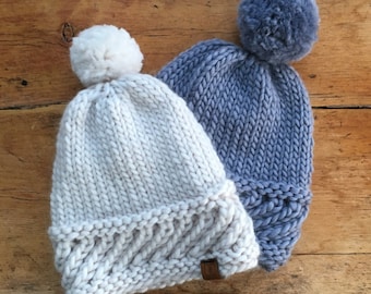 The softest hand knitted 100% merino beanie/pom pom hat with a textured band