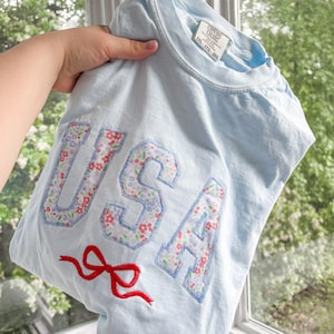 USA Girly Floral Applique with Embroidered Bow T-Shirt for Women | Patriotic, 4th of July, Memorial Day| Comfort Colors | Plus Size