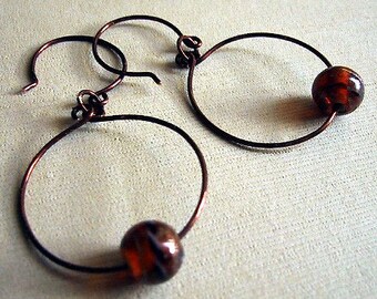 Copper hoop earrings with burnt orange art glass bead