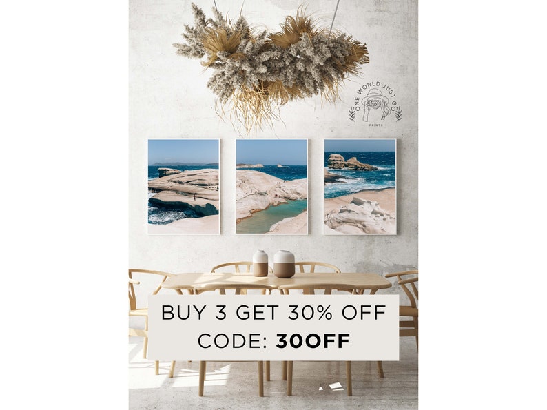 May include: Three framed photographs of a rocky coastline with turquoise water. The photos are hanging on a white wall above a wooden table with two chairs. The text "BUY 3 GET 30% OFF CODE: 30OFF" is displayed below the photos.