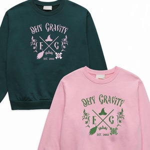 Borduurwerk Wicked Musical Elphaba & Glinda-sweatshirt, defy Gravity Quote Top Wicked Movie Fan Gift, Shiz University Halloween-cadeau voor haar
