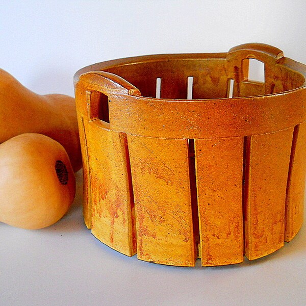 Basket with handles for fruit, bread or storage.