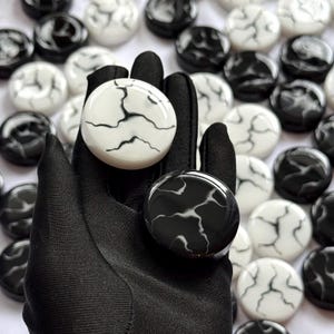 May include: A set of three ceramic nesting bowls in shades of blue, green, and white. The bowls feature a speckled glaze and a simple, modern design. The largest bowl is approximately 7 inches in diameter.