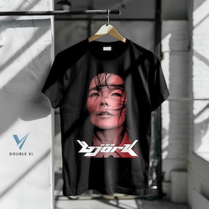 Bjork Face Graphic T-Shirt – Iconic Singer Portrait Tee, Red Tone Print, Unisex Black Shirt for Bjork Fans
