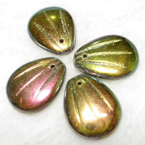 May include: Four iridescent teardrop-shaped beads. Each bead has a hole for stringing and features etched lines radiating from the center. The beads have a color-shifting effect, with hues of gold, green, and pink.