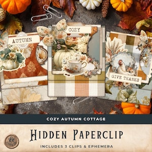 May include: A set of autumn-themed paperclips and ephemera. The designs feature pumpkins, floral arrangements, and the phrases "Autumn", "Cozy", and "Give Thanks". The set includes three clips and ephemera, ideal for scrapbooking or crafting projects.