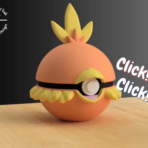 May include: A 3D-printed orange and yellow Torchic figure. The figure has a round body with a yellow crest and a black band. The image includes the text "Click! Click!" and a logo with a dog wearing glasses.
