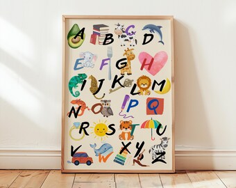 May include: A framed alphabet poster featuring colorful watercolor illustrations of objects corresponding to each letter. The artwork includes an avocado, books, a cow, a dolphin, an elephant, a fork, a giraffe, a heart, a chameleon, a leopard, a key, a lion, a moon, a ring, a sun, a tiger, an umbrella, a car, a whale, and a zebra.