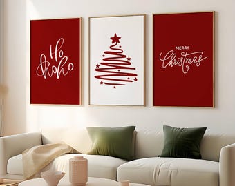 May include: Three red framed prints with white text and a stylised Christmas tree design. The left print says "Ho Ho Ho", the middle print has a red Christmas tree with white stars, and the right print says "Merry Christmas".