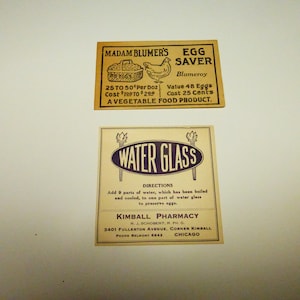 May include: Two vintage advertisements for a product called "Egg Saver" by Madam Blumer's. The top ad features a drawing of a hen and a basket of eggs. The bottom ad is for "Water Glass" and includes directions for use and the name of the pharmacy that sells it, Kimball Pharmacy. The text on the ads is in black and the background is a light brown.