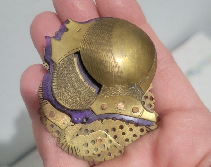 Vintage Brooch featuring a Brass Knight purple resin and brass gear elements