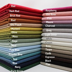 May include: Stacks of fabric in various colors, including red, dark red, mustard, olive, mint, and navy. The image displays a wide range of hues, from vibrant to muted tones, with labels identifying each color.