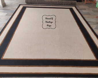 Handgjord nordisk rammatta, minimalistisk beige svart kantad ullmatta, modern skandinavisk inredning