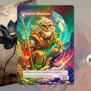 Op de afbeelding: Een glanzende speelkaart met een Goblin Shaman met staf tegen een fantasielandschap. De tekst "Goblin Shaman" en spelinstructies zijn inbegrepen. De kaart is 2/2.