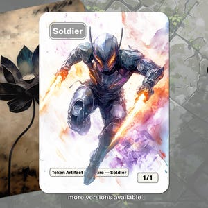 May include: A fantasy art card featuring a futuristic soldier with glowing orange energy weapons. The card is labeled "Soldier" and "1/1". A second card with a black lotus flower is visible in the background.