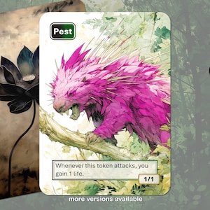 May include: A fantasy art card featuring a pink porcupine-like creature with sharp quills, labeled "Pest." The card includes the text "Whenever this token attacks, you gain 1 life." and "1/1." A second card with a black lotus flower is also visible.