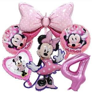 May include: A set of pink and white Minnie Mouse themed balloons for a birthday party. The set includes a large pink bow balloon, a Minnie Mouse balloon with a pink dress, a heart-shaped balloon with the text "Happy Birthday", a round balloon with Minnie Mouse's face, a number 4 balloon, and a round balloon with Minnie Mouse's face and the text "Minnie".