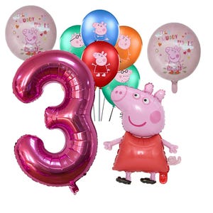 May include: A selection of birthday balloons featuring a pink number 3, several round balloons with a cartoon pig, and a large pig-shaped balloon. The round balloons display the text "Hello Muddy Puddles". The balloons are in various colors.