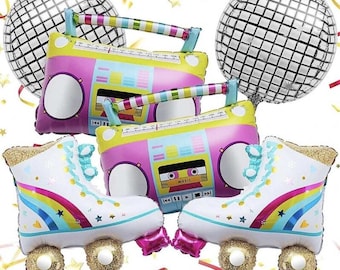 May include: A set of five foil balloons featuring a disco ball, two roller skates, and two boomboxes. The roller skates are white with rainbow stripes and gold wheels. The boomboxes are pink, yellow, and blue with a cassette tape and the word "MUSIC" printed on them.