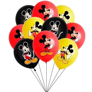 May include: A collection of eleven Mickey Mouse balloons in red, yellow, and black. Each balloon has a Mickey Mouse design. The balloons are tied together with black strings, suitable for a children's party or a themed event.