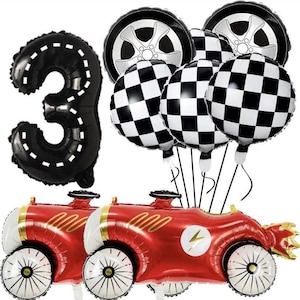 May include: A red race car balloon with a black lightning bolt design, two black and white chequered balloons, a black tyre balloon, and a black number 3 balloon.