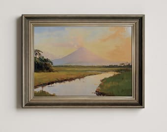May include: A framed painting of a landscape with a mountain in the background, a river in the foreground, and a cloudy sky. The mountain is a light purple color, and the river is a light blue color. The sky is a light blue color with some clouds.