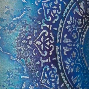 May include: Abstract close-up of a decorative design in shades of blue and white. The design features intricate patterns and shapes, with a textured appearance. The color palette includes deep blues and lighter turquoise hues, creating a visually appealing contrast.