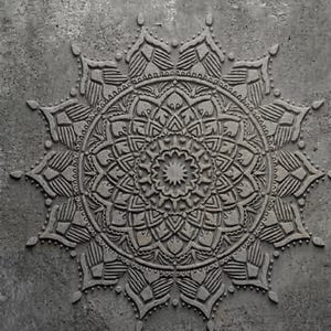May include: A circular gray concrete wall plaque featuring a deeply embossed, symmetrical mandala pattern. The design consists of concentric rings of intricate geometric shapes, petals, and pointed leaves, all rendered in a monochromatic stone texture.